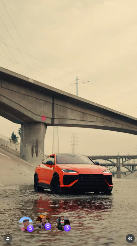Orange Lamborghini Urus in a concrete riverbed beneath a bridge